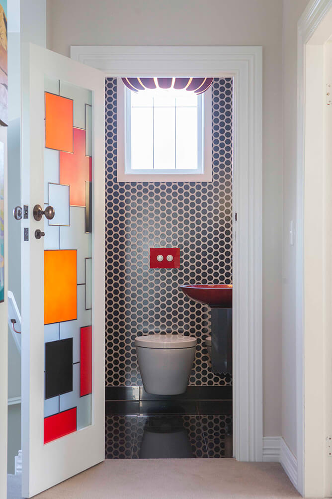 bathroom tiling with custom painted glass door